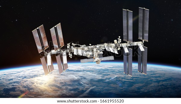 International space station on orbit of Earth\
planet. ISS. Dark background. Sun reflection. Elements of this\
image furnished by\
NASA