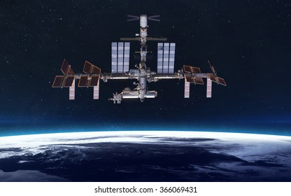 International Space Station over the planet Earth. Elements of this image furnished by NASA - Powered by Shutterstock