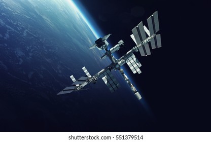 International Space Station over the planet Earth. Elements of this image furnished by NASA - Shutterstock ID 551379514