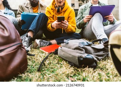 International Students Sitting Together On Green Campus Lawn - Group Of High School Teens Studying Outside College - Multiethnic Millenial Friends Doing Homework In University Park - Academic Concept