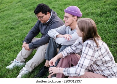 international students are together on green campus lawn - Group of high school teens studying outside college - Multiethnic millenial friends spend free time together.  - Shutterstock ID 2209312337
