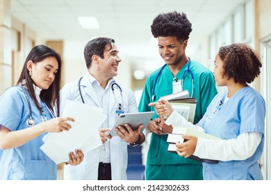 International Team Of Professional Doctors Having A Meeting In Conference Room At The Modern Hospital. Healthcare And Medical Development Concept.