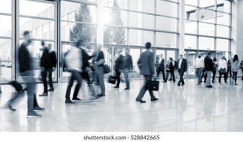 International Trade Fair Visitors Walking At A Modern Floor