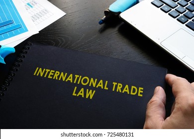 International Trade Law And Notebook On A Table.