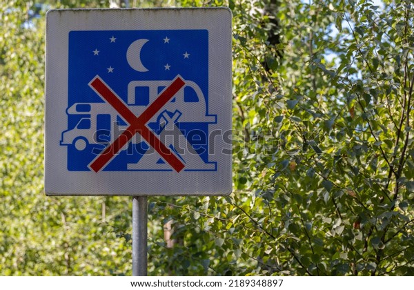 International traffic sign, warning  or symbol.\
Parking and staying overnight prohibited. Trucks, cars, buses and\
campers. Europe: Germany, France, Belgium, Poland, Spain, Hungary,\
Poland. Serie.