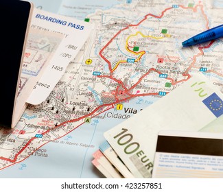 International travel concept. Passport, boarding pass, money, credit card, pen on map of tropic island.