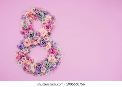 International Women's Day. Banner, Flyer, Beautiful Postcard For March 8. Flowers In The Shape Of The Number 8 On A Pink Background.