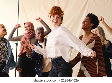 International Women's Day Candid Portrait Of Multi Ethnic Mixed Age Range Women Dancing