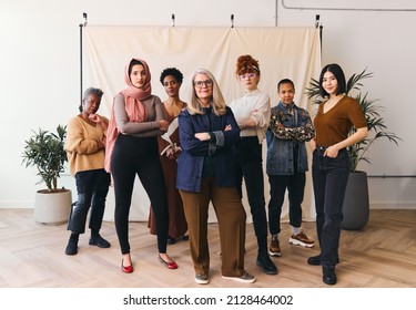 International Women's Day portrait of multi ethnic mixed age range women looking confidently towards camera, Embrace Equity