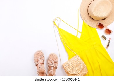 International Womens Day Sale. Woman Clothes & Accessories, Spring Summer Collection. Yellow Dress, Straw Hat & Shoulder Bag, Brown Sunglasses Eyewear. Nail Polish, Lip Gloss. Flat Lay, Background.