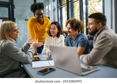 International workers group and team leader having teamwork discussion managing project at work in meeting room. - Powered by Shutterstock