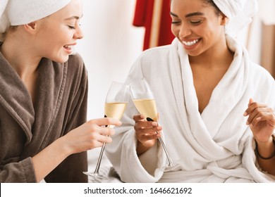 International Young Women Toasting With Champagne, Having Spa Day Together At Home