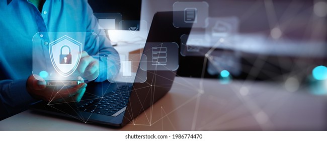 Internet, Cyber, Firewall Security Concept,Businessman Working With Smart Phone And Laptop Computer For Data Protection, Information Safety And Encryption, Secured Access To User Personal Data.