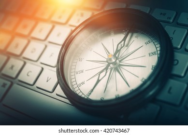 The Internet Navigator Concept Photo. Vintage Metallic Compass on the Computer Keyboard. Navigation Through the Internet. - Shutterstock ID 420743467