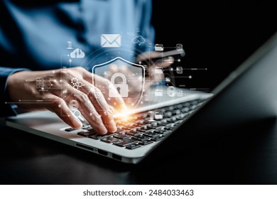 Internet network cybersecurity concept, data privacy protection from malicious attacks, digital information technology security,Businesswomen use laptop with shield security interface virtual network