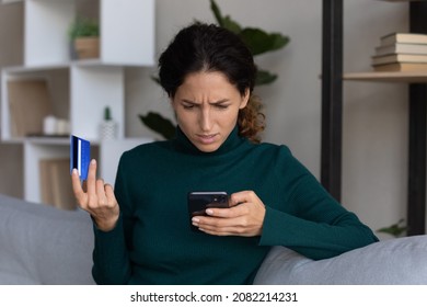 Internet scam. Concerned young hispanic lady looking on smartphone screen having finance savings stolen from bank card as money fraud result. Upset nervous latin woman become online scammers victim