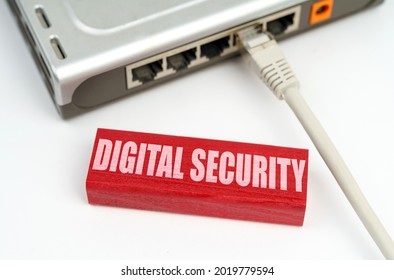 Internet and security concept. There is a router connected to the network on the table, next to a plaque with the inscription - Digital security