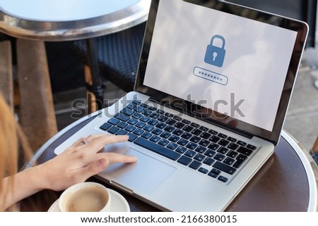internet security concept, user typing login and password on computer, secured access, data protection