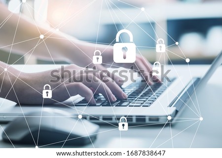 Internet security and data protection concept. Hands on laptop