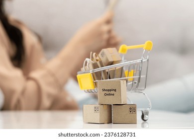 internet shopping e commerce concept, Parcel boxes of product on laptop computer related buy from online store.