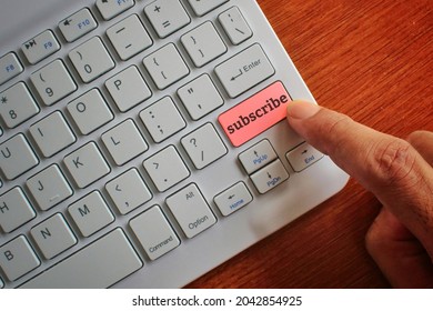 Internet and technology concept. Finger pressing keyboard label with SUBSCRIBE. - Shutterstock ID 2042854925