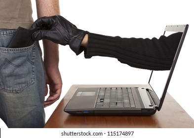 Internet theft - a gloved hand reaching through a laptop screen to steal a wallet from a man. - Powered by Shutterstock