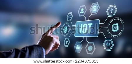 Internet of things - IOT concept. Businessman offer IOT products and solutions. Internet, business, Technology and network concept. Virtual button.