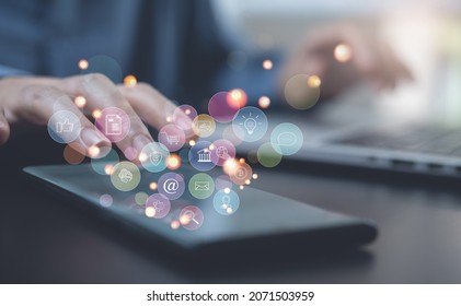 Internet of Things IoT, digital marketing, online shopping concept, Woman using mobile smart phone and laptop with internet network connection, social media, technology icons on virtual screen