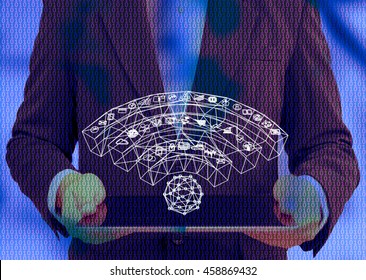 Internet of things (IOT) and fintech concept . Wifi icon Man suit holding tablet with abstract binary code background , copyspace