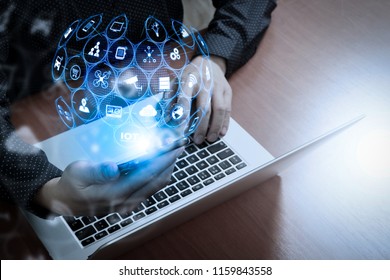 Internet of Things (IOT) technology with AR (Augmented Reality) on VR dashboard.business man hand using smart phone,laptop, online banking payment communication network technology. - Shutterstock ID 1159843558