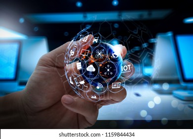 Internet of Things (IOT) technology with AR (Augmented Reality) on VR dashboard.businessman showing world globe.Elements of this image furnished by NASA - Shutterstock ID 1159844434