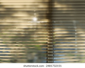The interplay of light and shadow from tree ornaments casting patterns on the roller blinds. - Powered by Shutterstock
