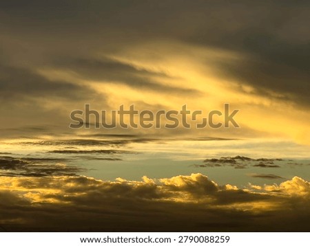 Interplay of sunlight and shadow in dynamic cloudscape at sunset in southwest Florida, for motifs of transition and change