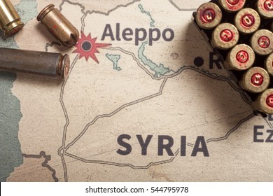 Interpretation on konflikt in Syria. The fired cases and bullets from rifle. Background view on section area of Aleppo, Syria. 