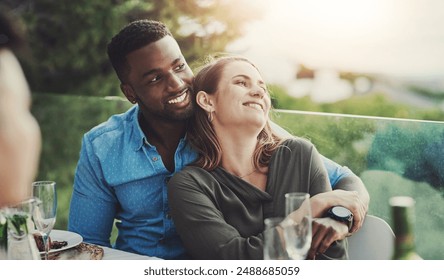 Interracial couple, celebration and lunch date as happy, cheerful and excited in group at table. Woman, man and hug with together with embrace, affection and anniversary at social event in restaurant - Powered by Shutterstock