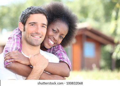 interracial couple embracing - Powered by Shutterstock