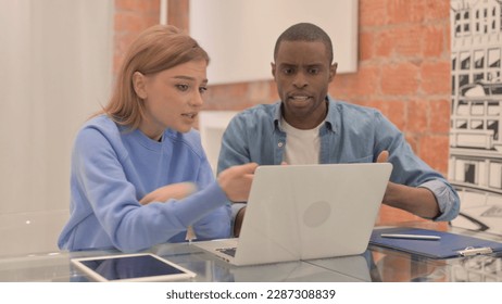 Interracial Couple Fighting while Using Laptop, Angry Wife - Powered by Shutterstock