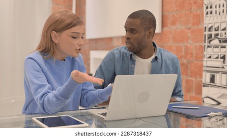 Interracial Couple Fighting while Using Laptop, Angry Wife - Powered by Shutterstock