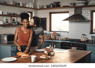 Interracial couple, kiss and cooking breakfast in kitchen for morning, love or care in marriage at home. Happy man kissing woman for food, nutrition or hug in happiness for healthy relationship - Powered by Shutterstock