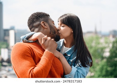 Interracial Couple Kissing in Urban Setting During Daytime - Powered by Shutterstock