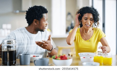 Interracial couple, kitchen and eating meal for breakfast, bonding together and love with support. Woman, man and sharing in home for nutrition, talk and care for relationship as partner in apartment - Powered by Shutterstock