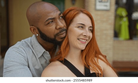 Interracial couple smiling on an urban street having a close moment, reflecting love, togetherness, and family bonds in an outdoors city setting - Powered by Shutterstock