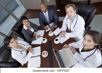 Interracial Group Of Business Men & Women, Businessmen And Businesswomen And Doctors Team Meeting In Hospital Boardroom