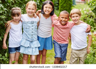 Interracial group of children as friends in garden - Shutterstock ID 1108402217