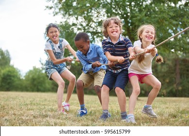 Interracial group of kids playing at the park - Powered by Shutterstock