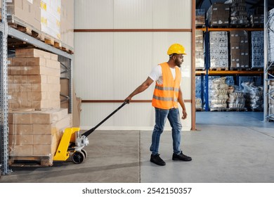 Interracial industrial worker pulling pallet jack full of boxes and goods and preparing shipment at storage. - Powered by Shutterstock