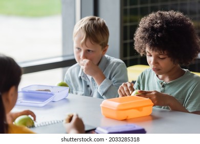 Interracial Kids Having Lunch In School Eatery