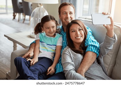 Interracial parents, child and selfie on couch for smile, hug and relax with care, diversity or memory in home. Father, mother and daughter on sofa for embrace, social media or love in family house - Powered by Shutterstock