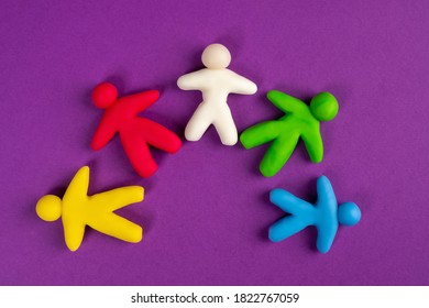 Interracial relations. Tolerance. Multicolored figures of people top view. Different colors represent different skin colors. Lack of racism. People with different skin colors nearby. Racial tolerance
