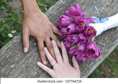 Interracial Wedding Couple Holding Hands